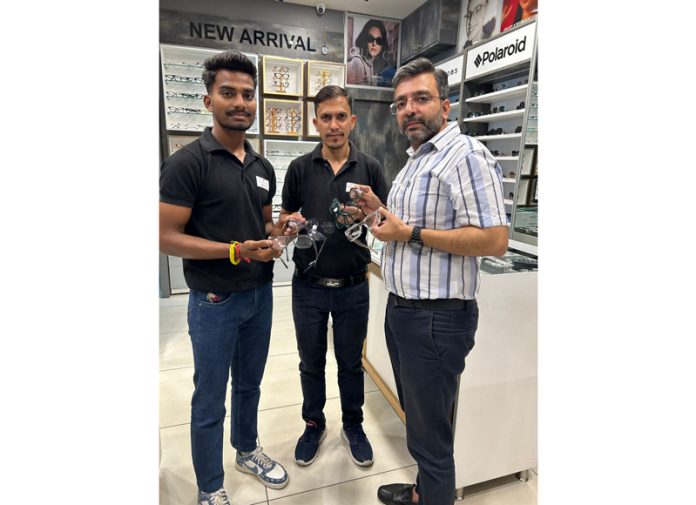 A dignitary at Chashma Junction Goel Opticians showing eyeglasses.