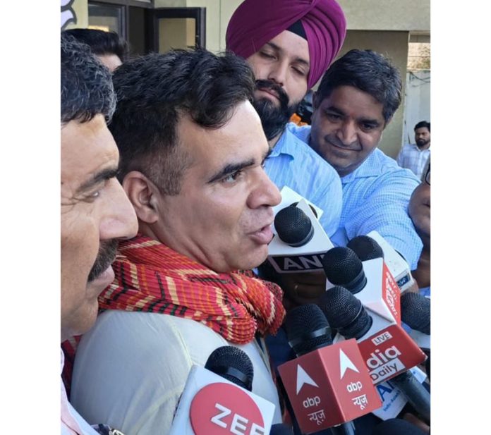 BJP Jammu and Kashmir President Ravinder Raina along with BJP MP Jugal Kishore Sharma interacting with media at party office in Jammu on Wednesday.