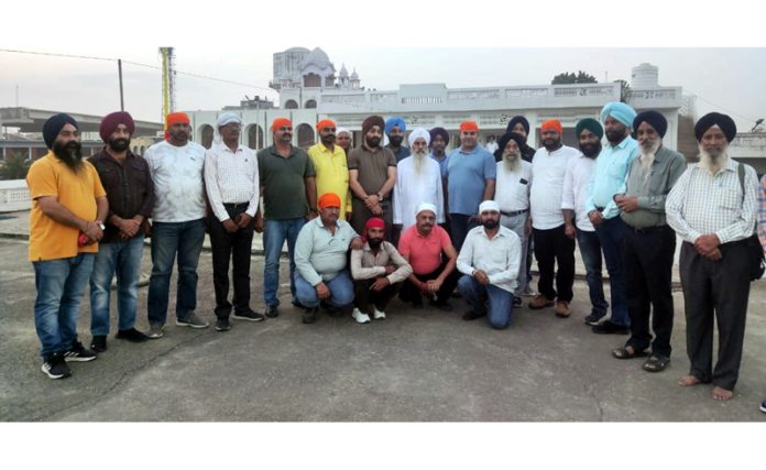 Karan Singh Wazir and transporters with Mahant Manjit Singh.