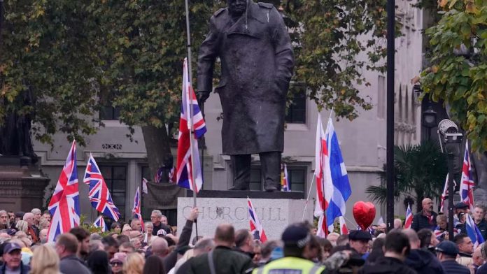 Supporters of far-right British figure rally as  anti-racism demonstrators mount counter-protest