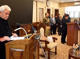 LG Manoj Sinha administering oath of Pro-tem Speaker to Mubarak Gul in Srinagar on Saturday.