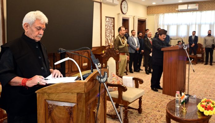 LG Manoj Sinha administering oath of Pro-tem Speaker to Mubarak Gul in Srinagar on Saturday.