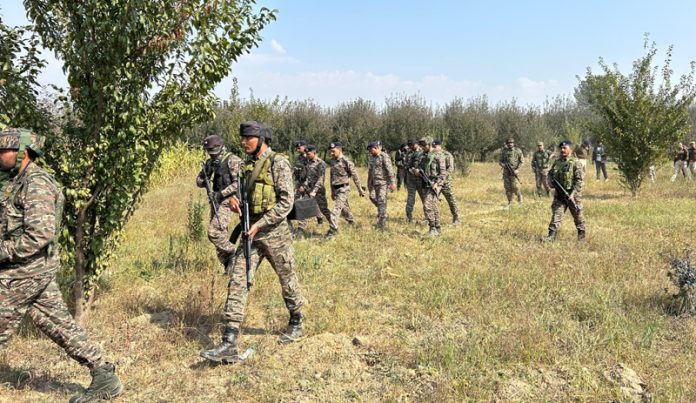 Security forces during searches at Waduna, Shopian on Friday. — Excelsior/Younis Khaliq