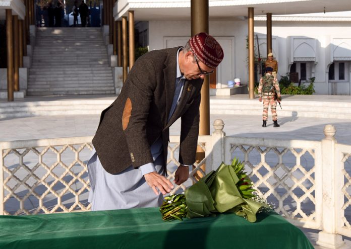 Omar Abdullah pays obeisance at the mausoleum of NC founder and his grandfather, Sheikh Muhammad Abdullah before taking oath as the CM on Wednesday. -Excelsior/Shakeel