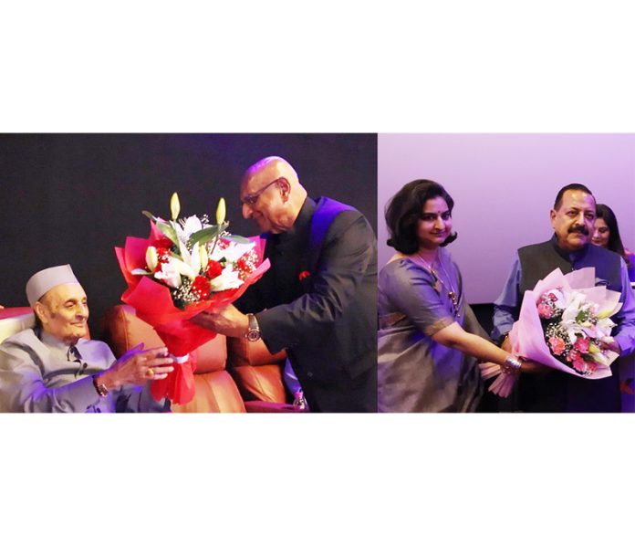 Dr Karan Singh and Union Minister Dr Jitendra Singh being welcomed by organizers during special screening of film on Baba Haidakhan at New Delhi on Saturday.