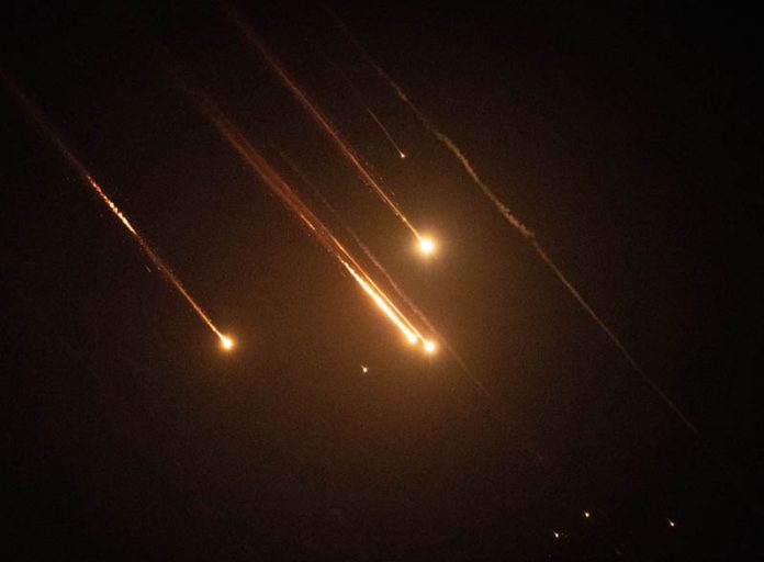 Projectiles from Iran intercepted by Israel fly through the sky above Jerusalem. (UNI)