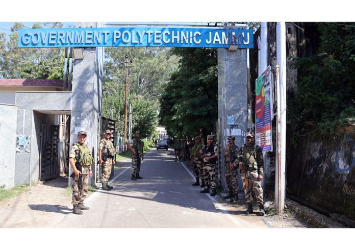 Security personnel maintaining a vigil outside the counting center in Jammu on Monday. -Excelsior/Rakesh