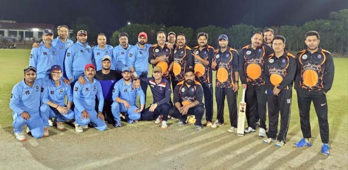 Cricket teams posing for group photograph.