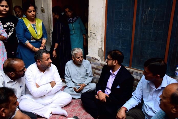 Minister for FCS&CA Satish Sharma meeting family of Shashi Abrol on Friday.