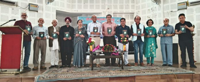 Prominent litterateurs and Dogri Sanstha members releasing Prof Lalit Magotra's book.