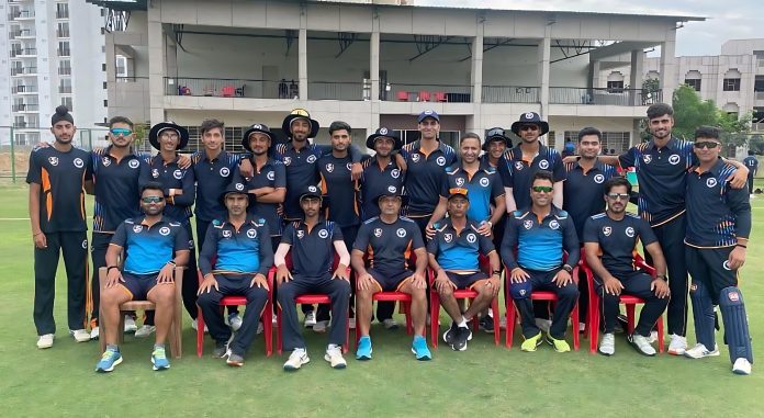 J&K U-19 team posing for group photograph along with staff.