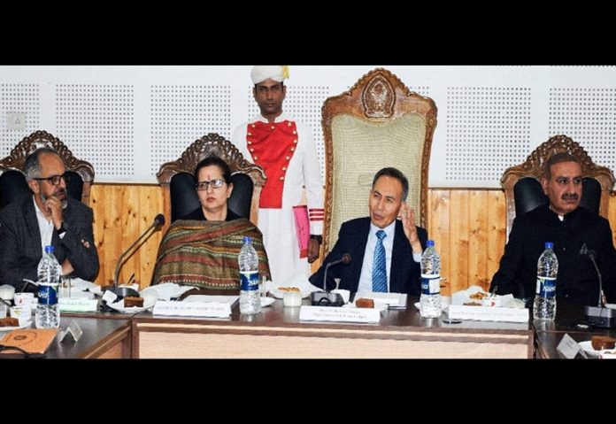 CJ chairing a meeting.