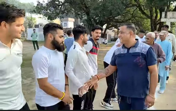 Dignitary interacting with players before start of a cricket match at Samba.