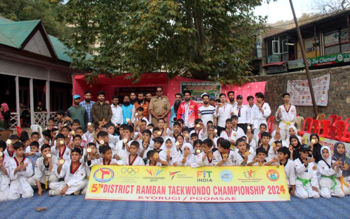 Police Officer posing along with athletes at Ramban on Sunday.