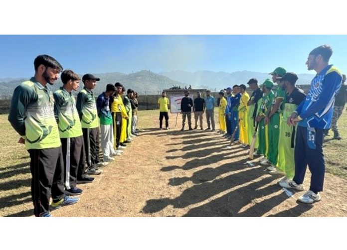 Teams posing for group photograph before start of the match at Surankote, Poonch.