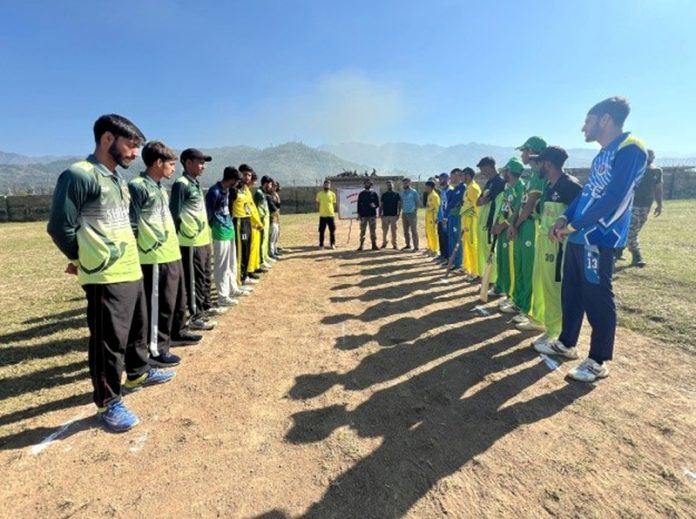 Teams posing for group photograph before start of the match at Surankote, Poonch.