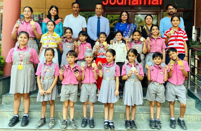 Students of Jodhamal posing along with medals.