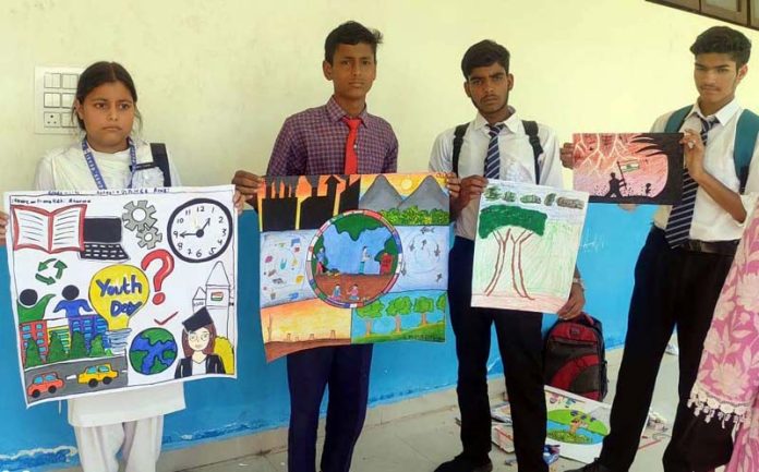 Students showing their paintings during Inter-School Zonal Level Youth Festivals at Poonch.