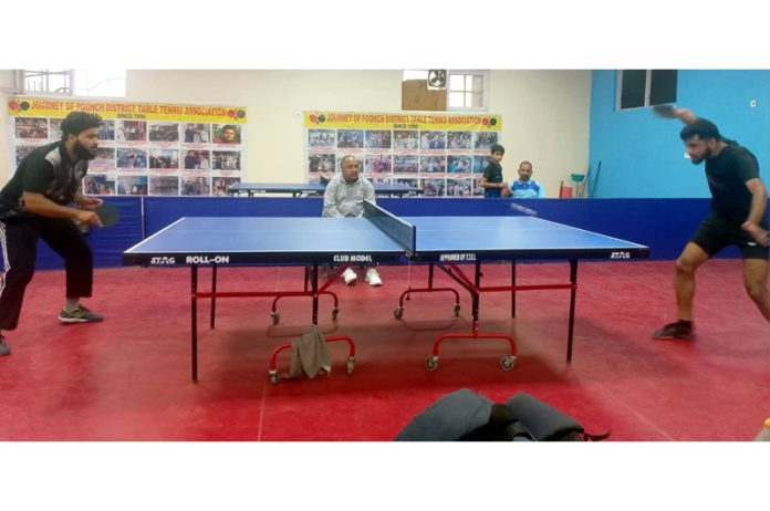 Table Tennis players in action during a match at Poonch.