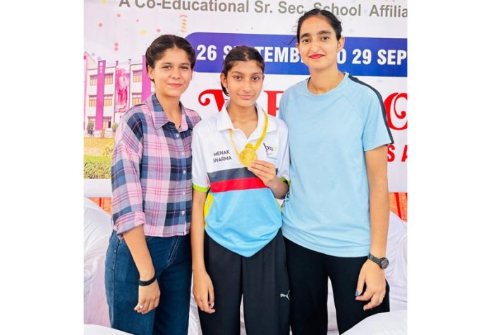 Mehak Sharma posing along with medal.