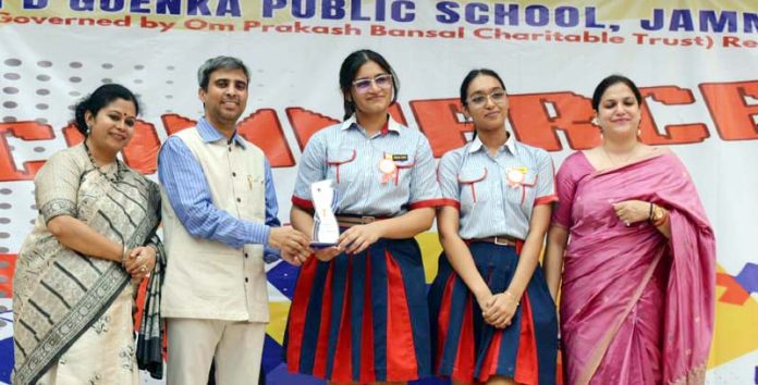 Dignitaries presenting trophy to winning school team.