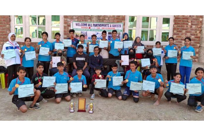 Kho-Kho players posing along with certificates during the closing ceremony at Kulgam. 