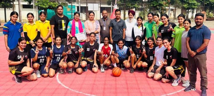 Girls Basketball team posing along with dignitaries at Jammu.