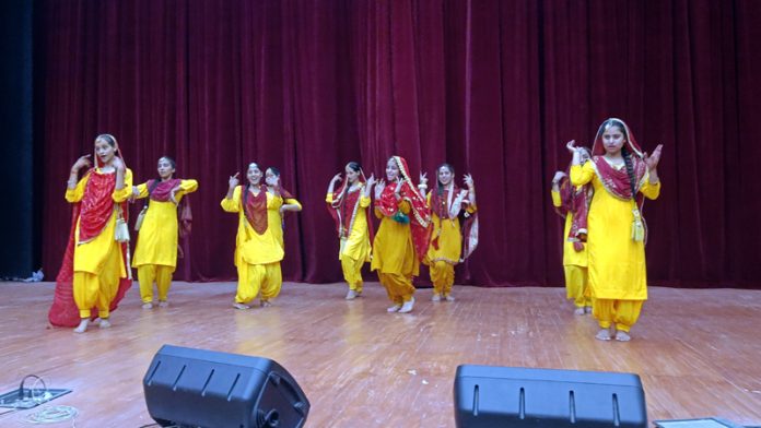 Girls performing a folk dance during a programme at Reasi.