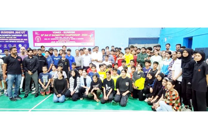 Arvind Gupta, MLA Jammu West posing along with badminton players for a group photograph.