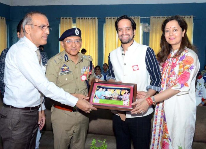 ADGP Jammu Anand Jain receiving souvenir from management of KCPS.