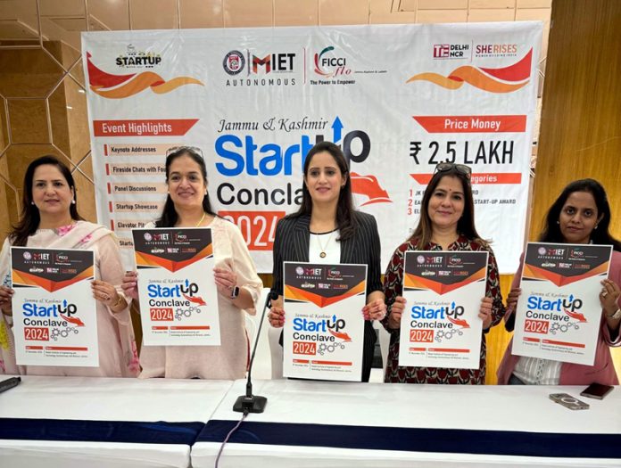 Dignitaries holding pamphlets of J&K Startup Conclave 2024 during press conference at Jammu.