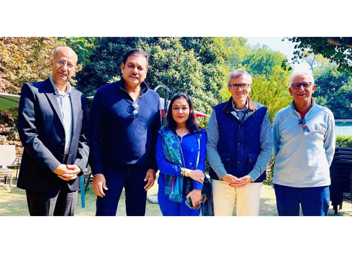 Founder and Chairman LLC, Vivek Khushalani and world renowned commentator and former captain of Team India Ravi Shastri posing with NC vice president Omar Abdullah at his Gupkar residence in Srinagar on Monday. (UNI)