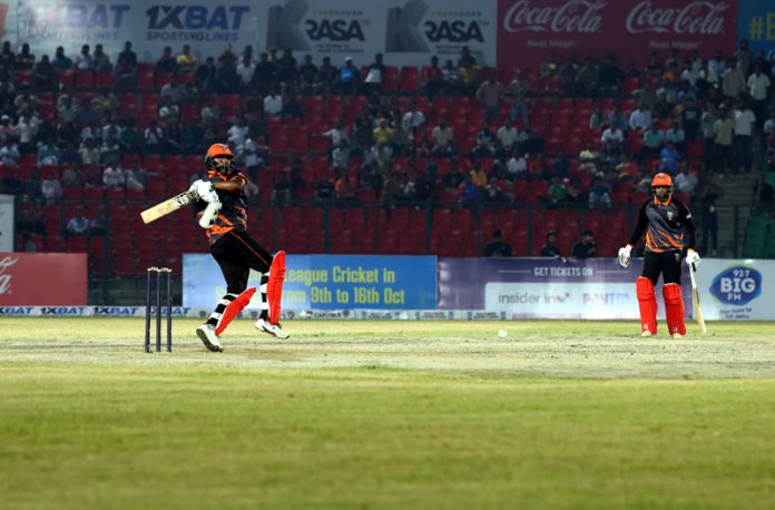 Batsman hitting a boundary during a match at MA Stadium Jammu on Thursday. - Excelsior/Rakesh