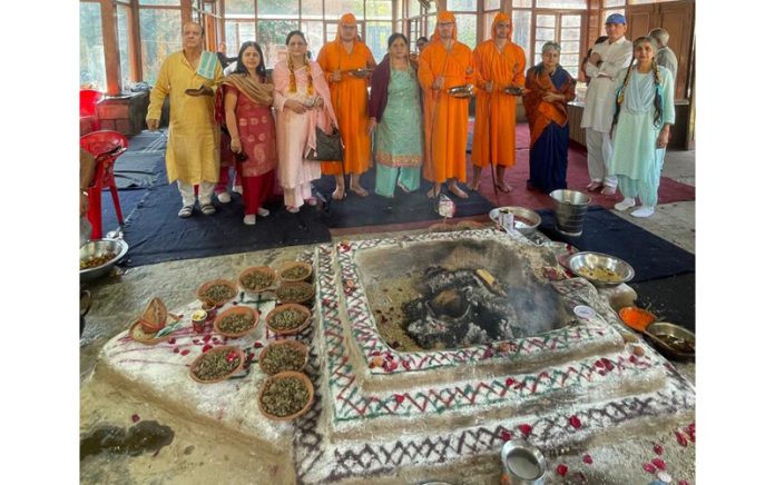 Guests and priests during Collective Yagnopaveet ceremony at Kheer Bhavani in Ganderbal district.