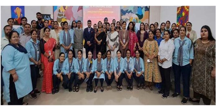 Teachers posing along with dignitaries during a workshop at KC International School.