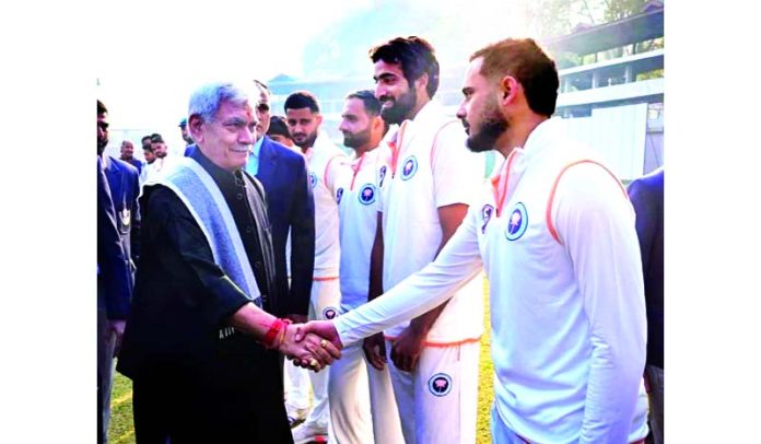 LG Manoj Sinha interacting with players before start of the Ranji match at Srinagar on Saturday.