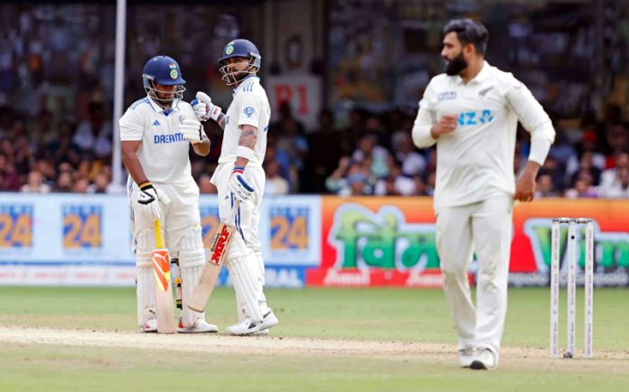 Virat Kohli and Sarfaraz Khan after hitting their fifties against New Zealand at Bengaluru on Friday.