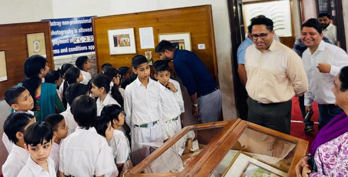 Director, Deptt of Archives, Archaeology & Museum Kuldeep Krishan Sidha along with students of orphanage at Dogra Art Museum in Jammu.