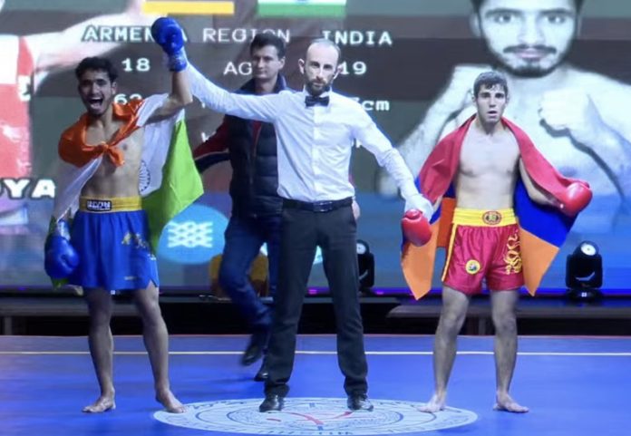 Musharaf cheers after referee declared him winner during Eurasian Professional Sanda League title fight in Georgia.