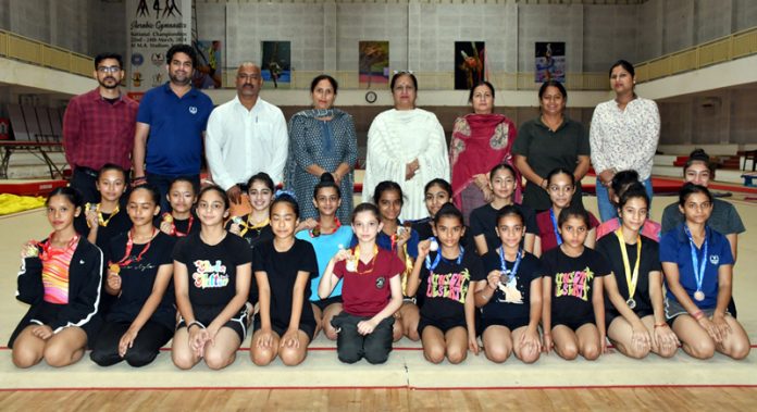 Young gymnasts posing during closing ceremony at Jammu.