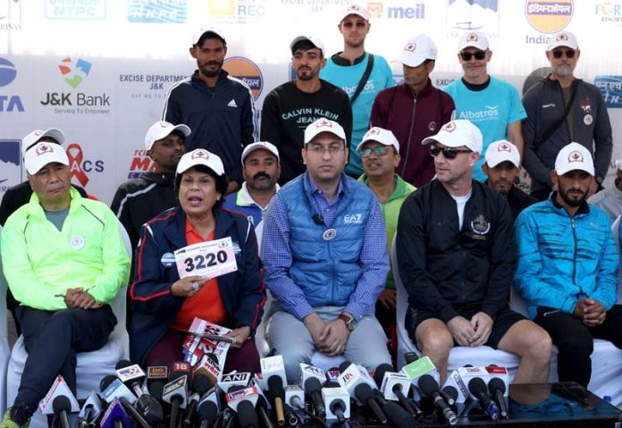 Director Tourism Raja Yaqoob along with other international runners during a press conference ahead of Kashmir Marathon in Srinagar on Saturday. -Excelsior/Shakeel