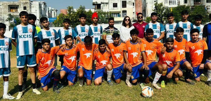 Football teams posing for a group photograph.