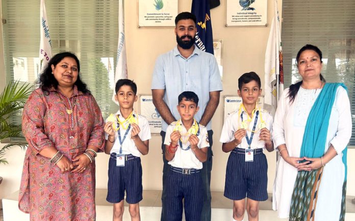 Students of Cambridge International School, Jammu showing medals they won at Inter-District Roller Skating Championship in Jammu.