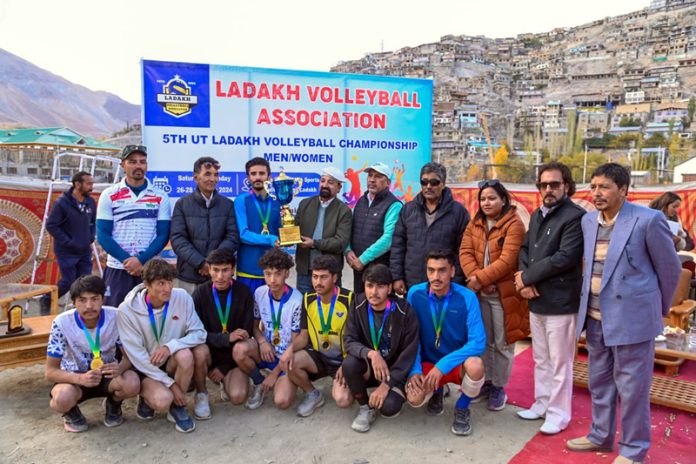 Winners display trophy at 5th UT Ladakh Volleyball Championship.