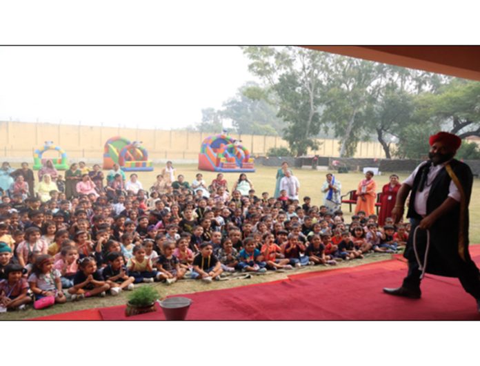 Toddlers enjoying magic show during a programme at APS Damana.