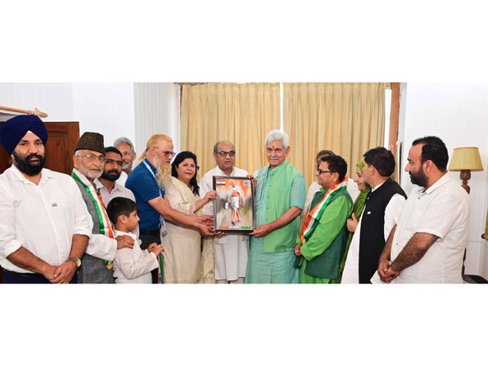 Lt Governor Manoj Sinha meeting with members of Gandhi Global family.