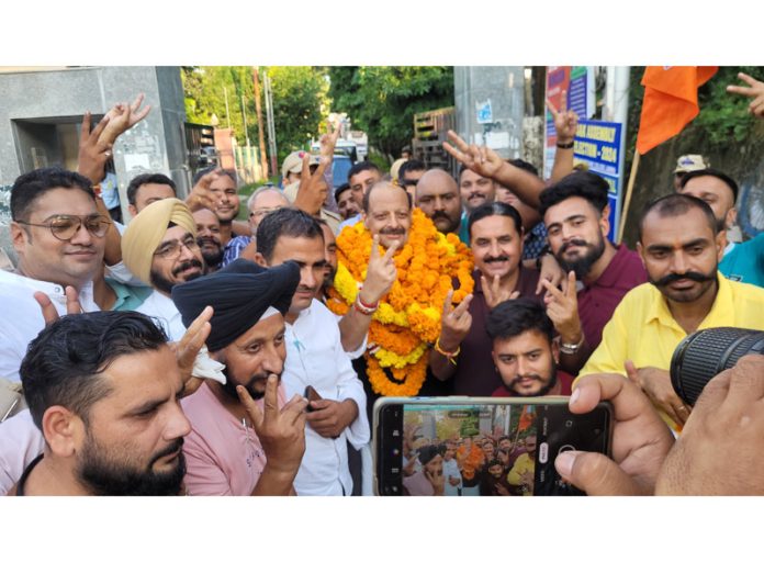 Senior BJP leader Devender Singh Rana showing victory sign after being declared winner from Nagrota Assembly segment. —Excelsior/Rakesh