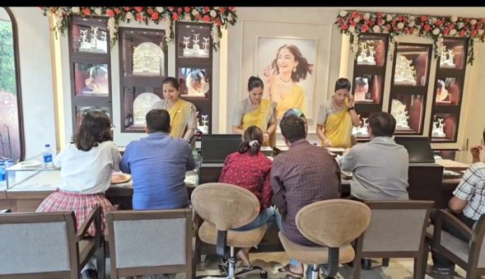 Customers busy in purchasing at re-launched store of Tanishq in Jammu on Sunday.