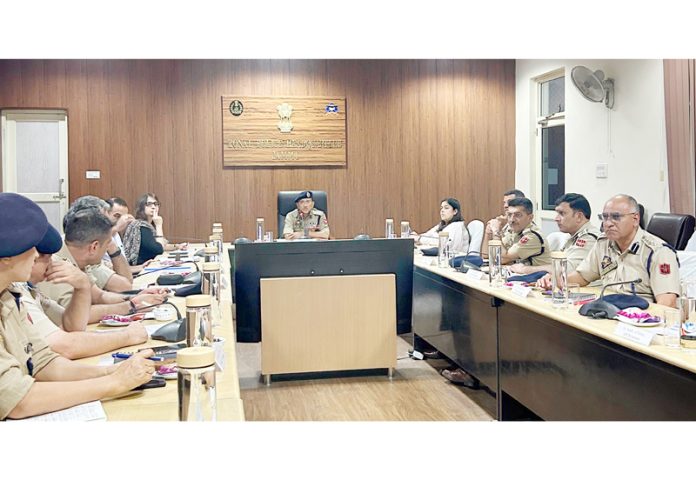 ADGP Jammu Anand Jain chairing a meeting of police officers on Monday.