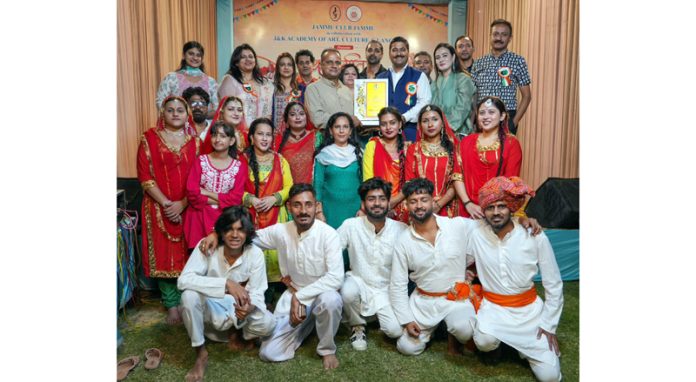 Artists posing for a group photograph during a function held at Jammu Club on Sunday.